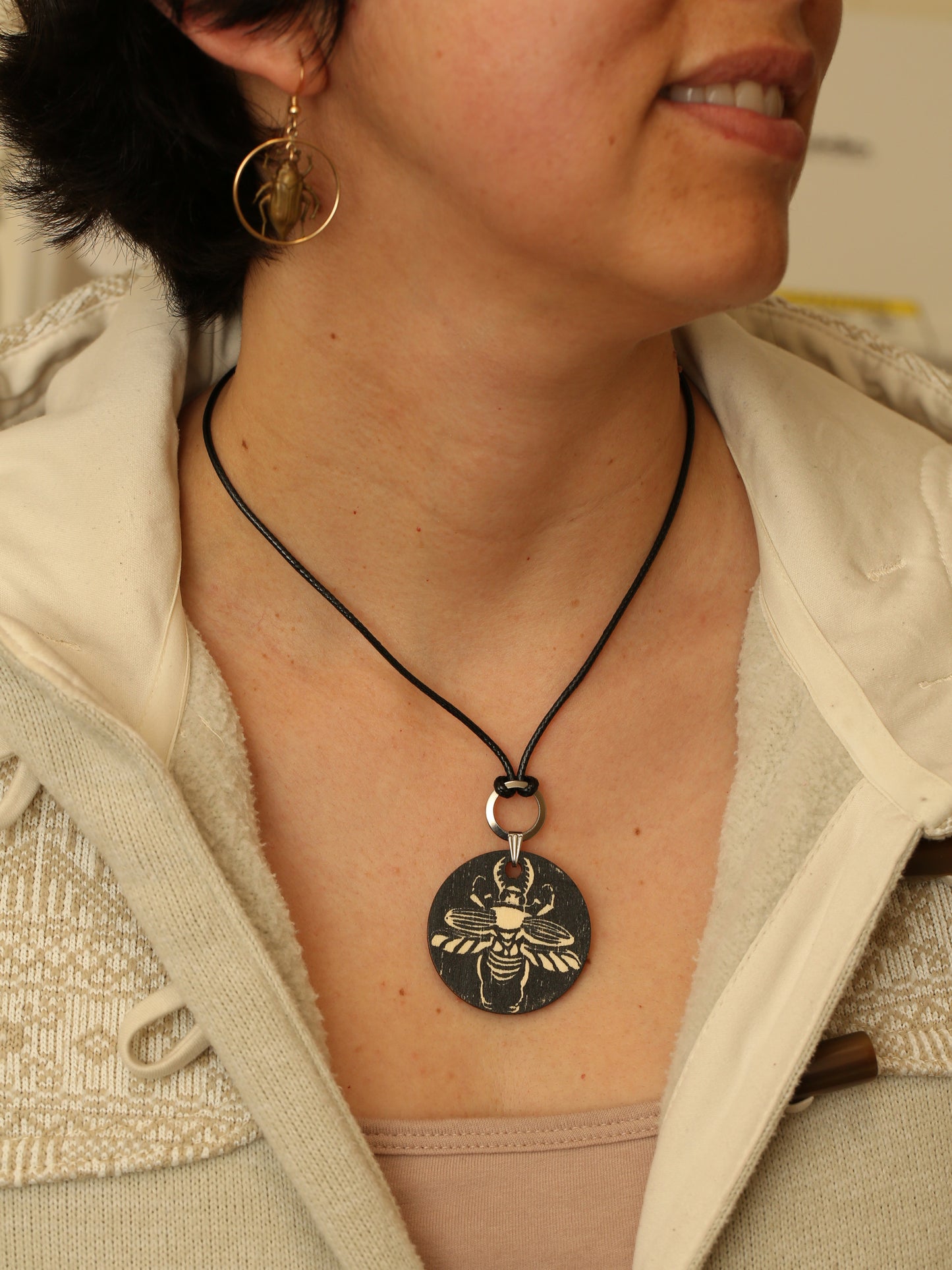 Sawtooth beetle hand printed wooden pendant