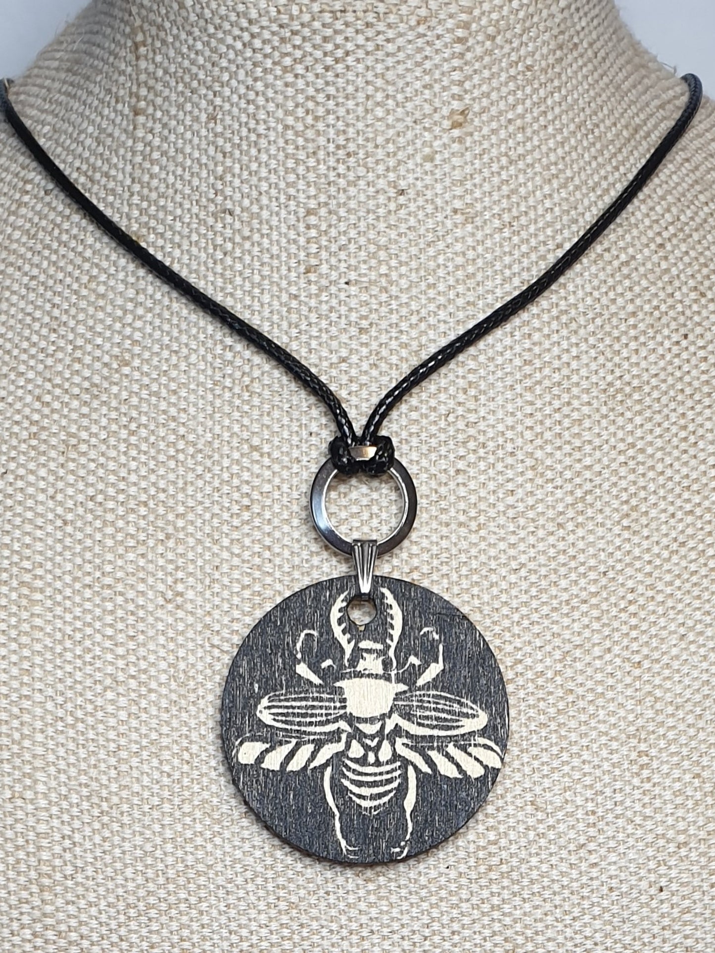 Sawtooth beetle hand printed wooden pendant