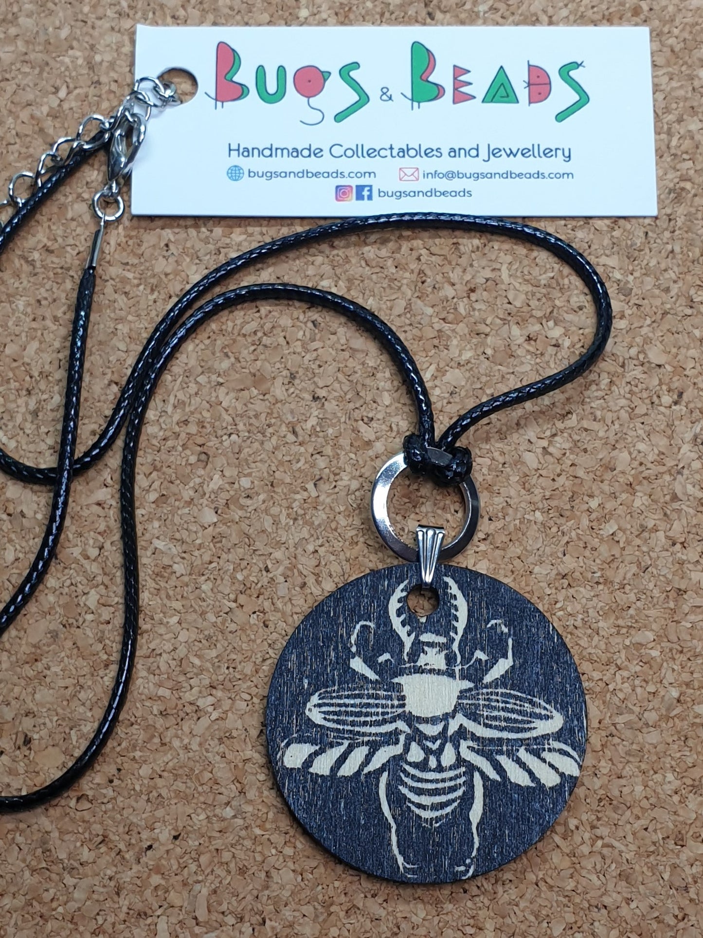 Sawtooth beetle hand printed wooden pendant