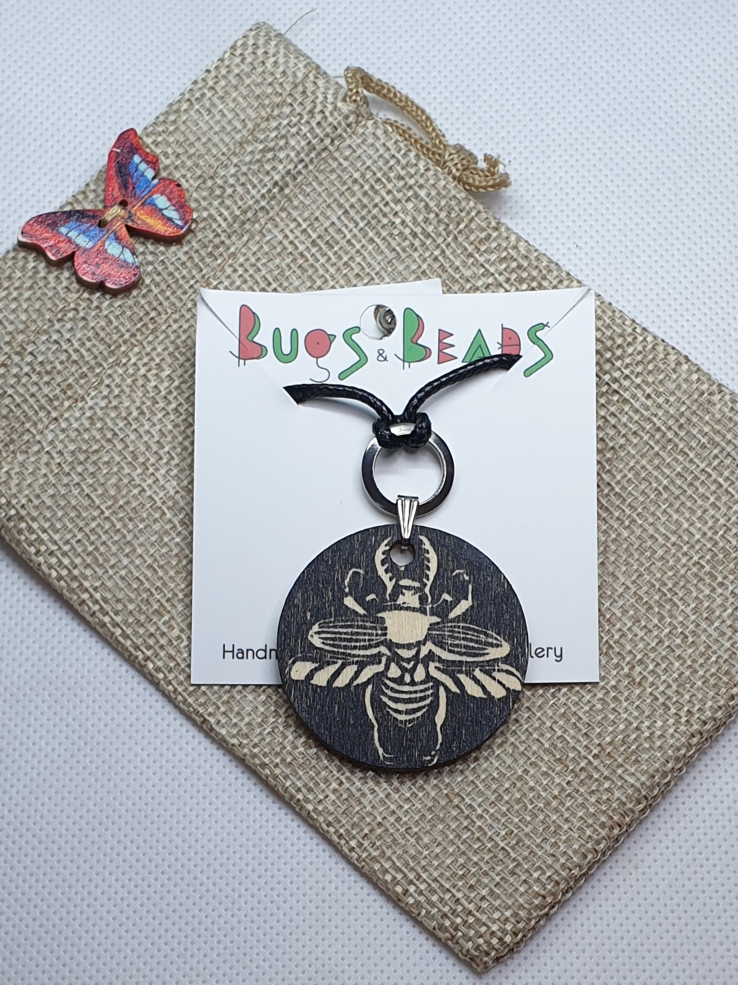 Sawtooth beetle hand printed wooden pendant