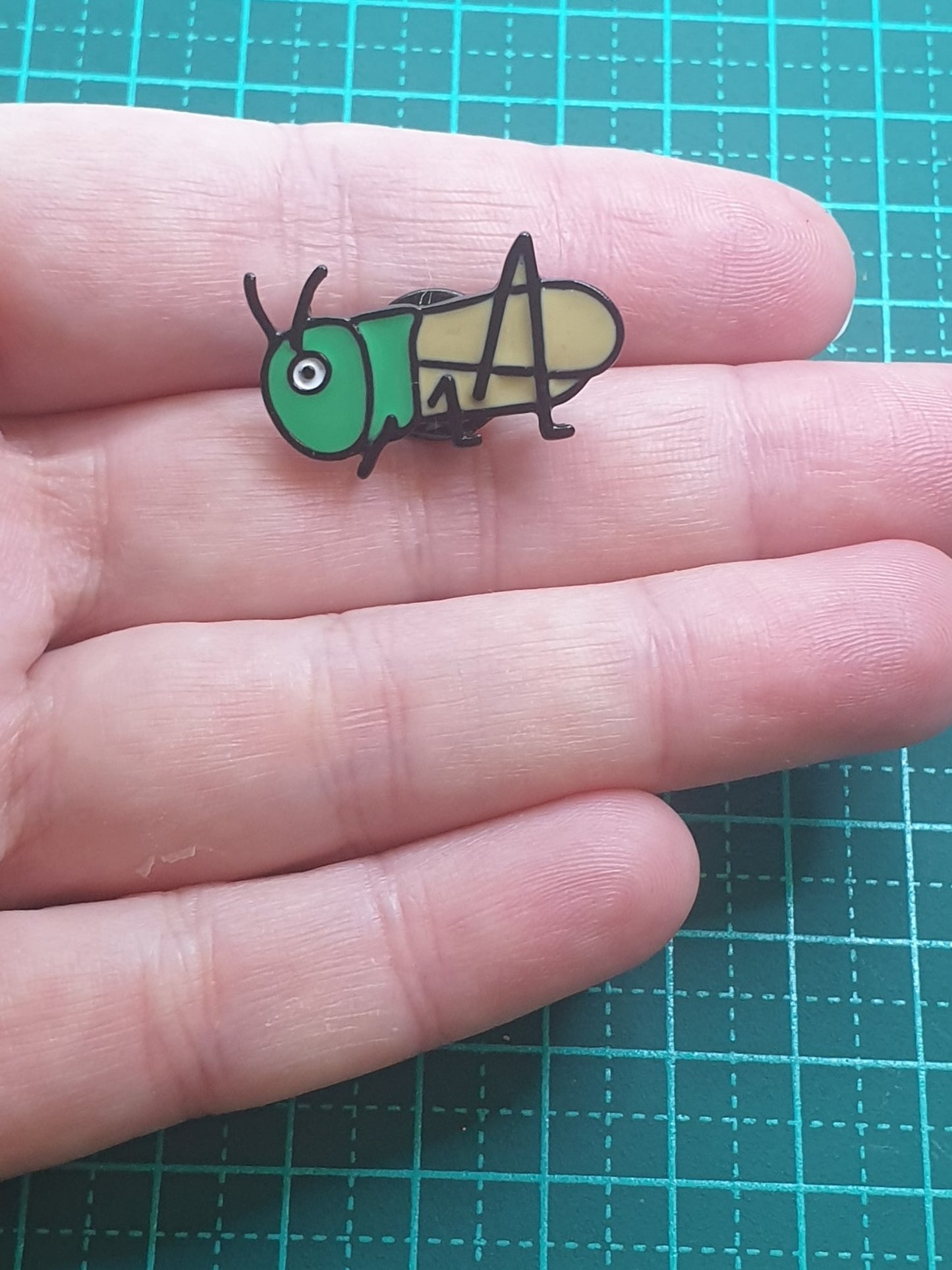 Grasshopper cartoon pin