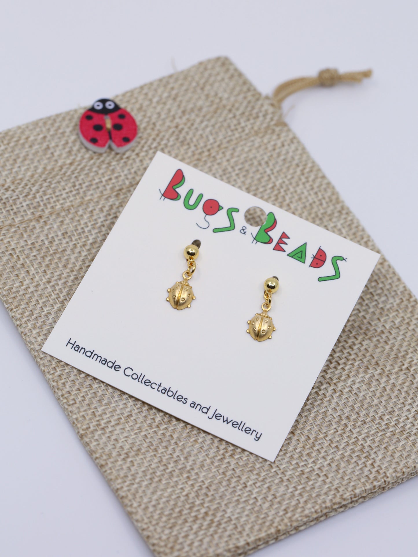 tiny ladybird on studs