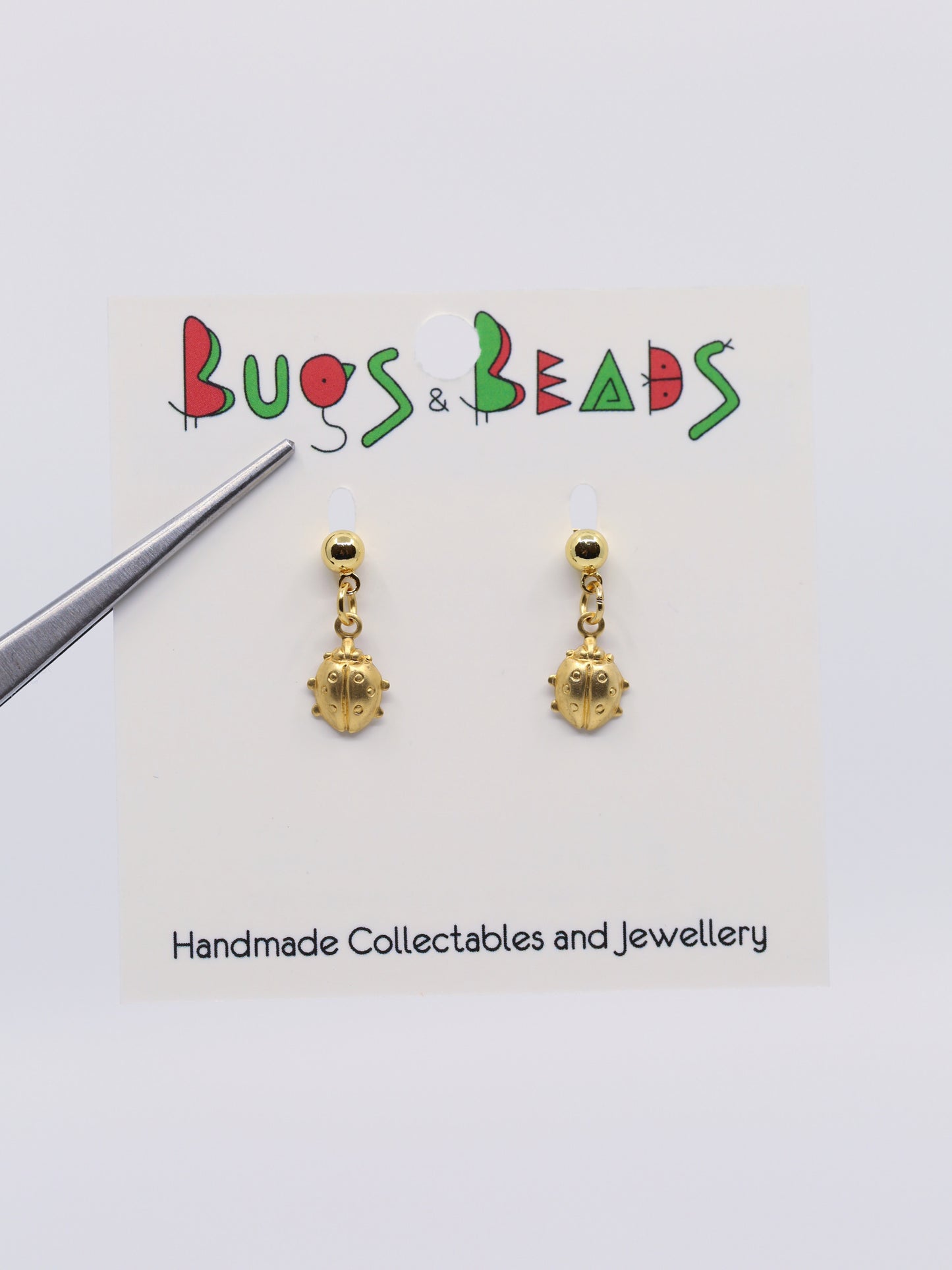 tiny ladybird on studs