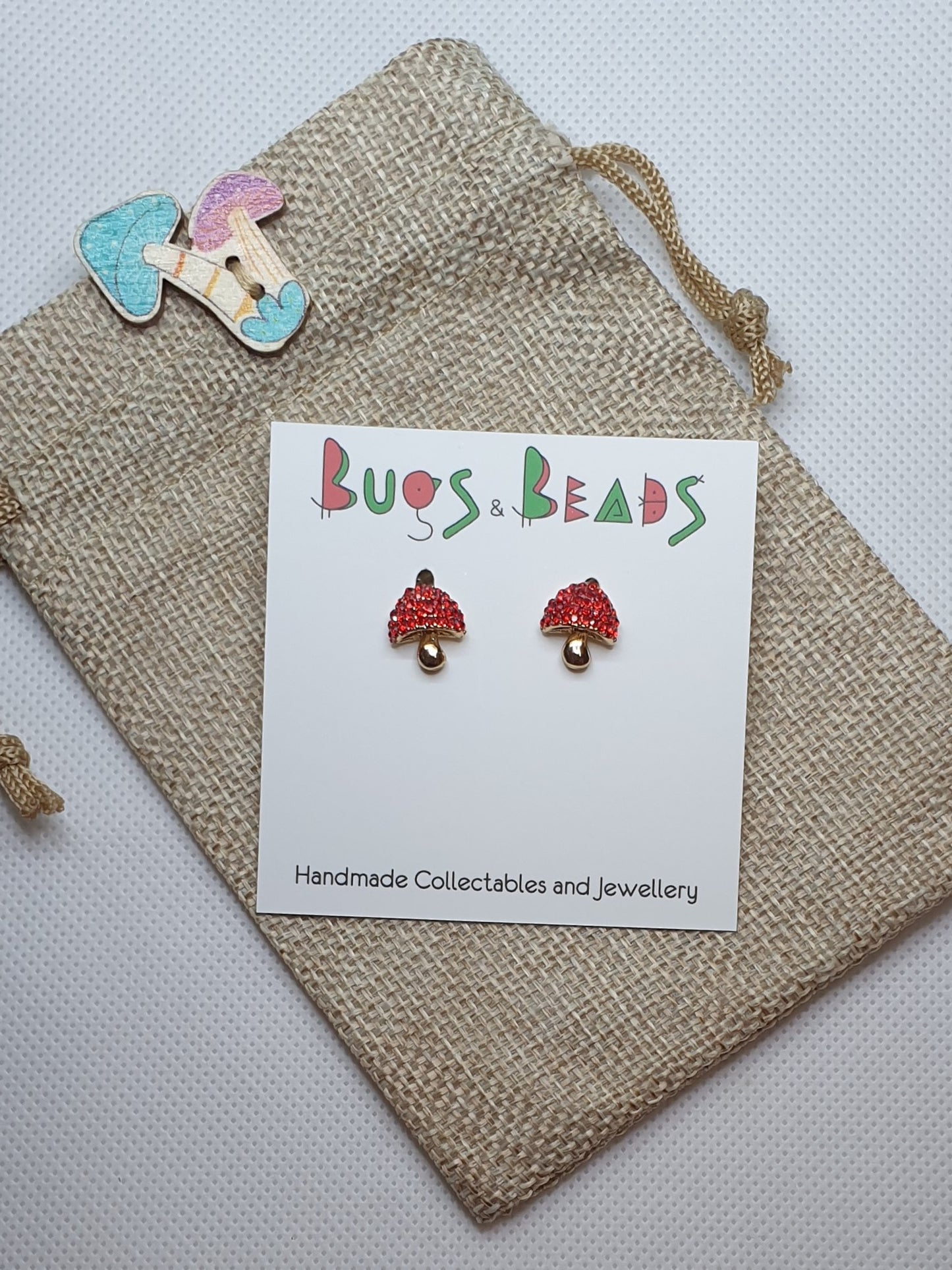 Red shiny mushroom stud earrings