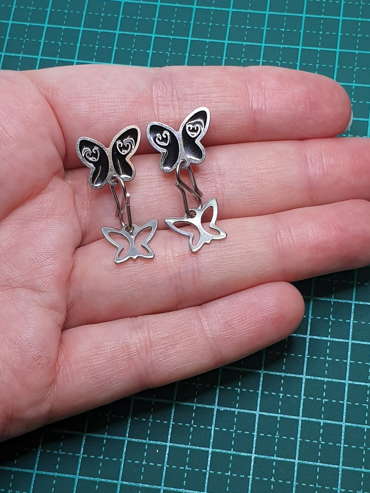 Black butterfly stud earrings