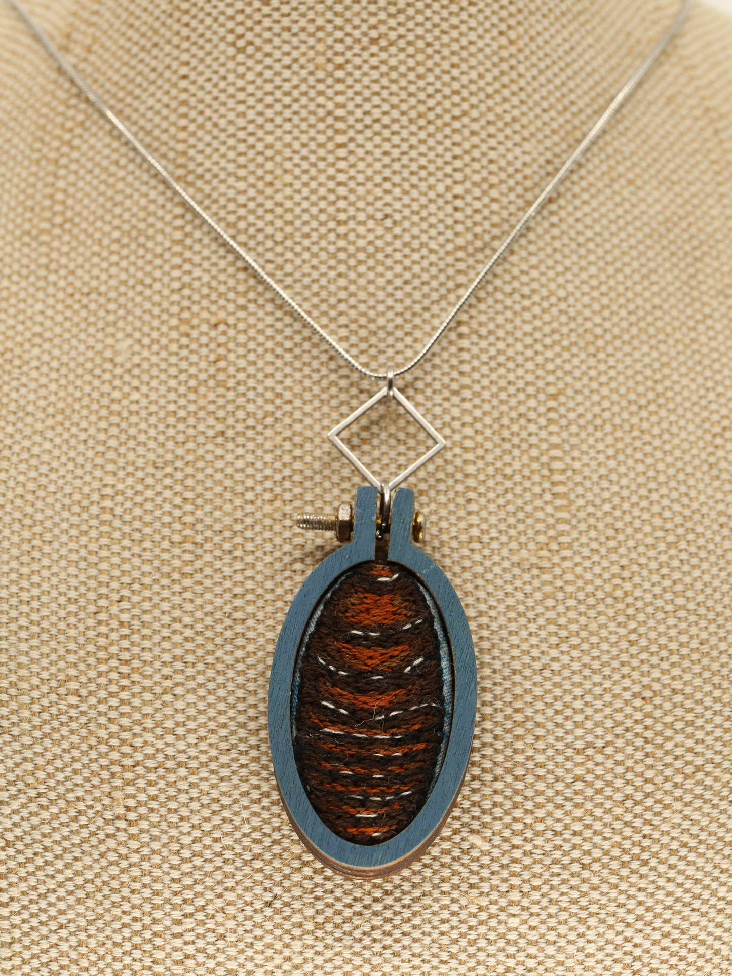 Burrowing cockroach embroidered necklace