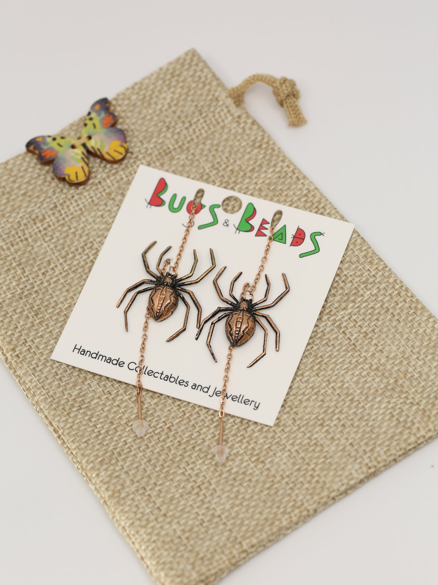 Spider earrings on a thread