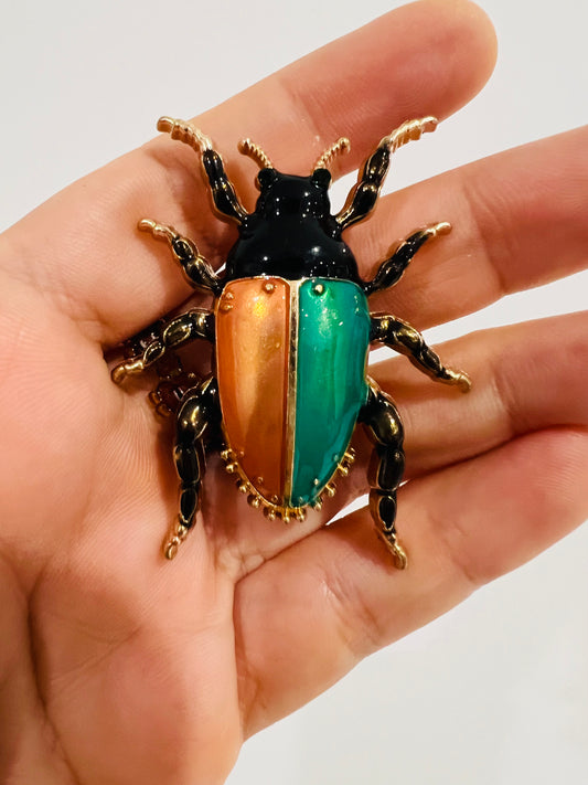 Harlequin beetle brooch