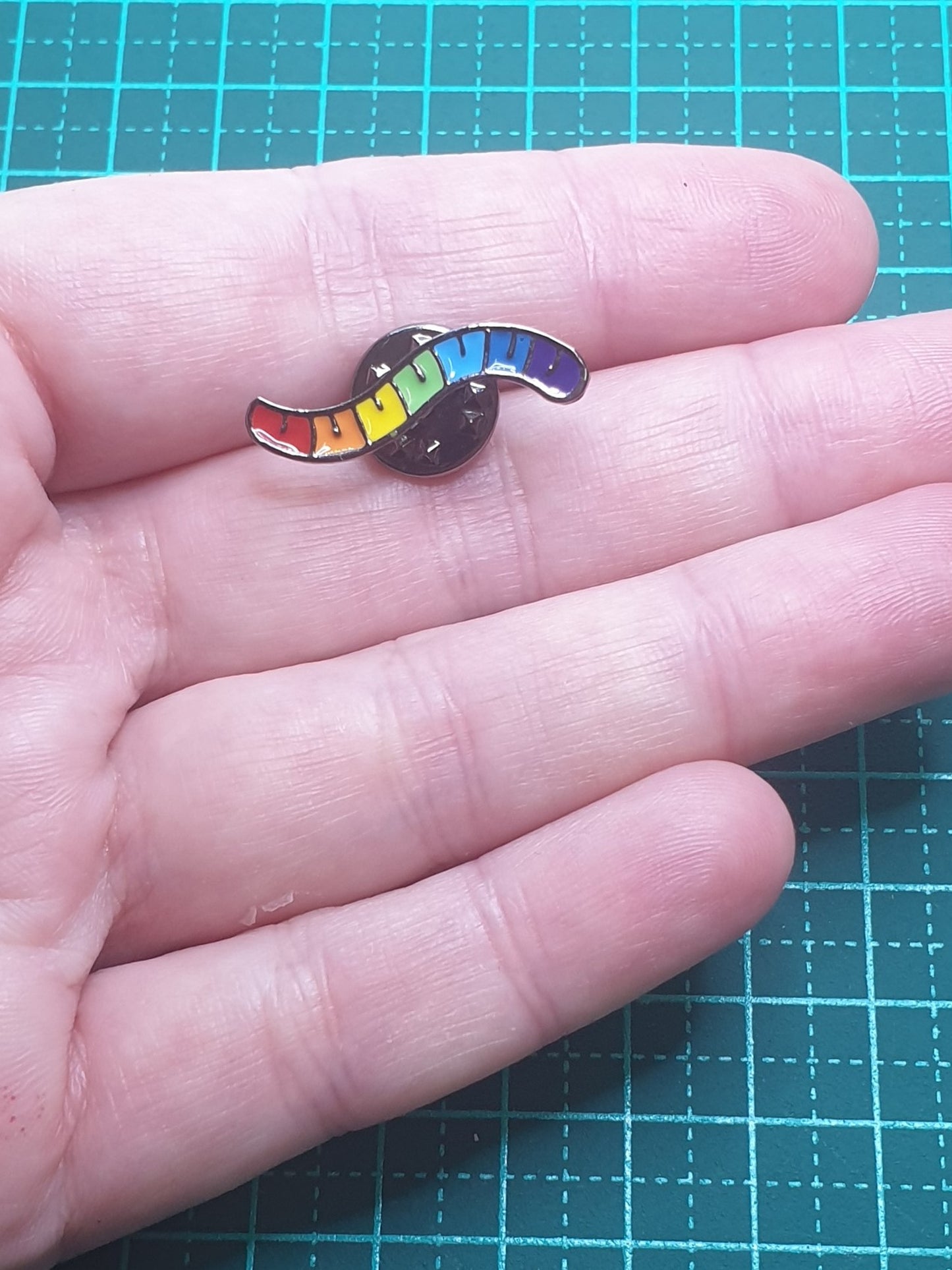 Rainbow Grub cartoon pin