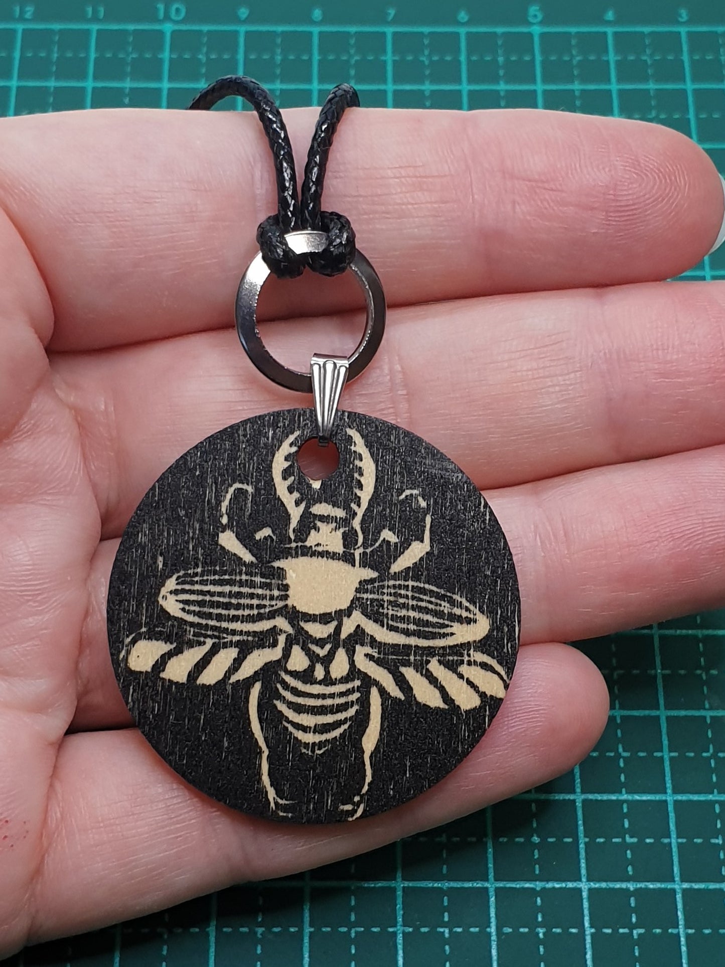 Sawtooth beetle hand printed wooden pendant