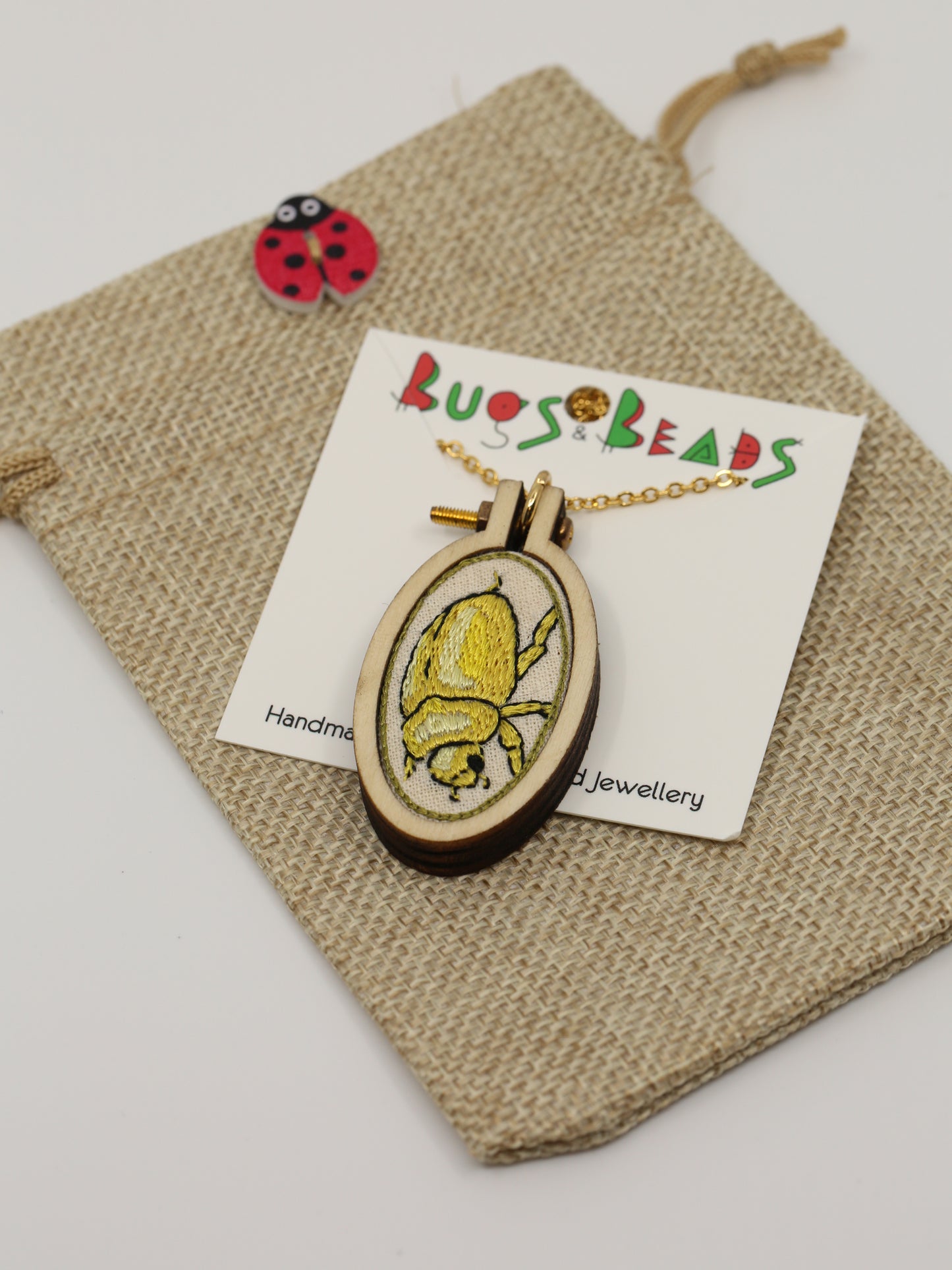 Christmas beetle embroidered necklace