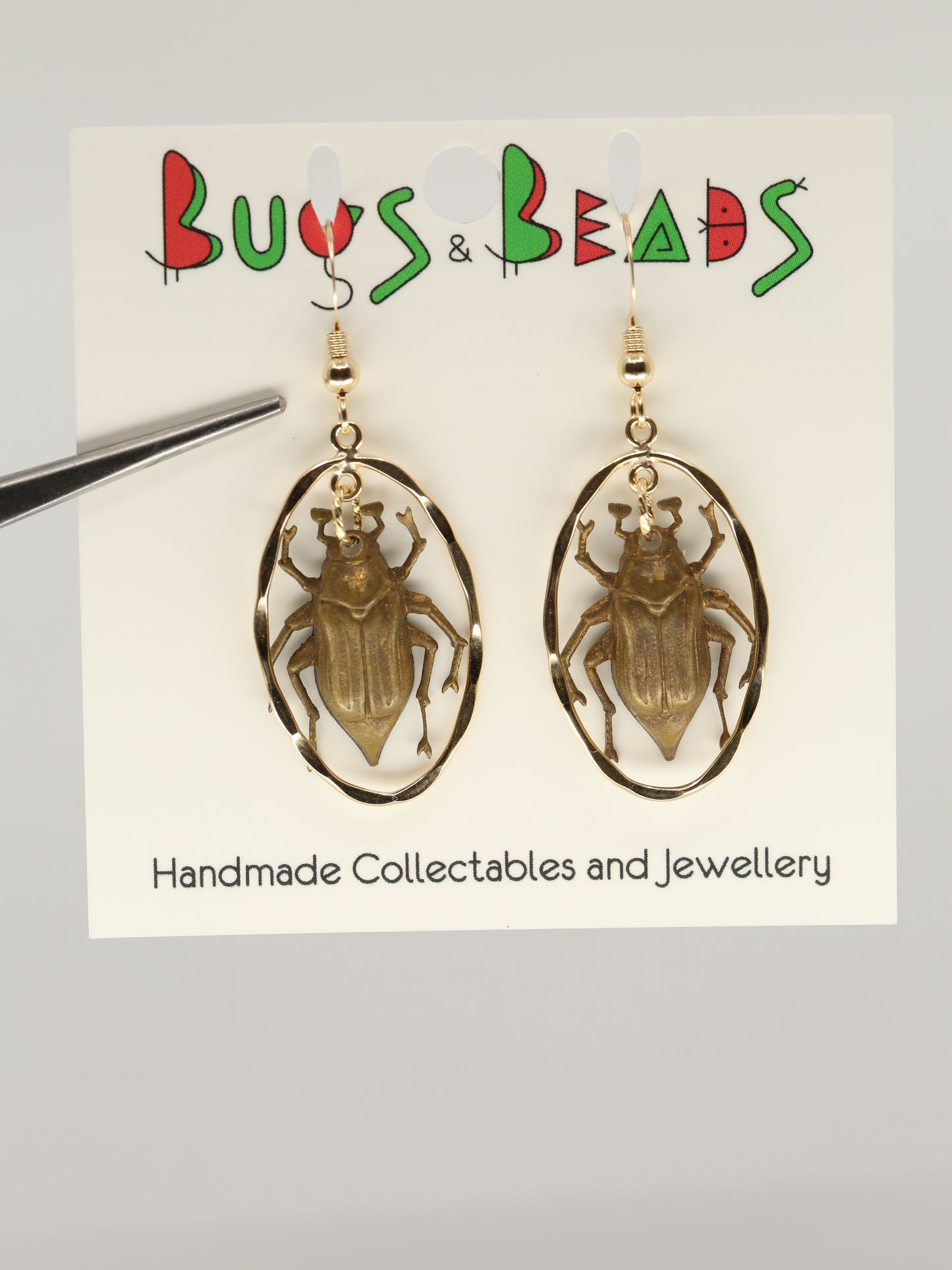 Chafer/June beetles on gold-filled chandelier