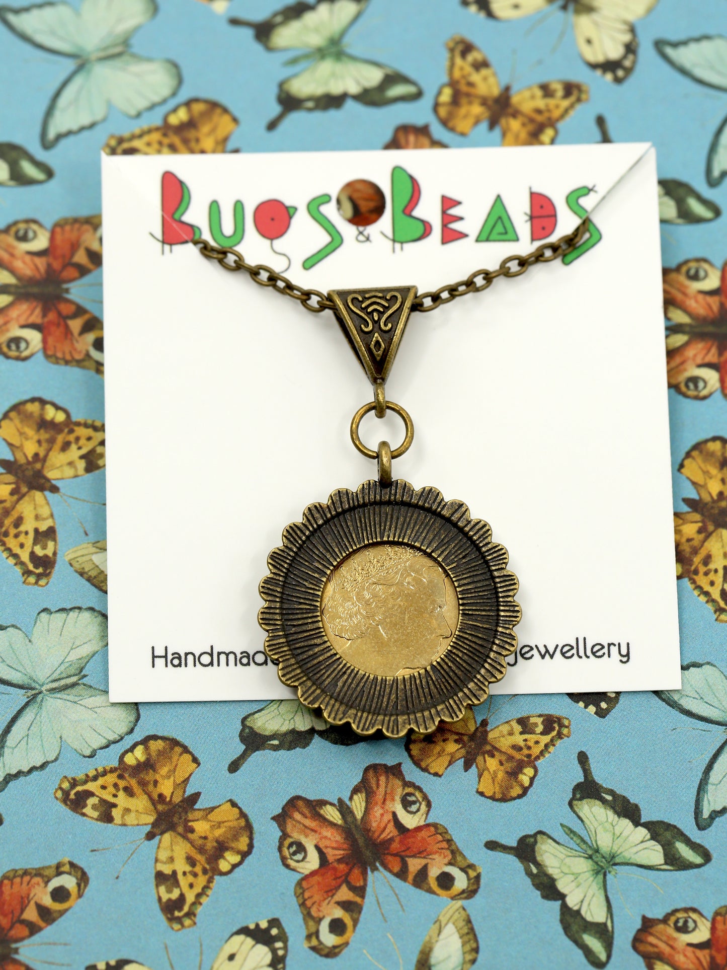 Ulysses butterfly decimal coin necklace