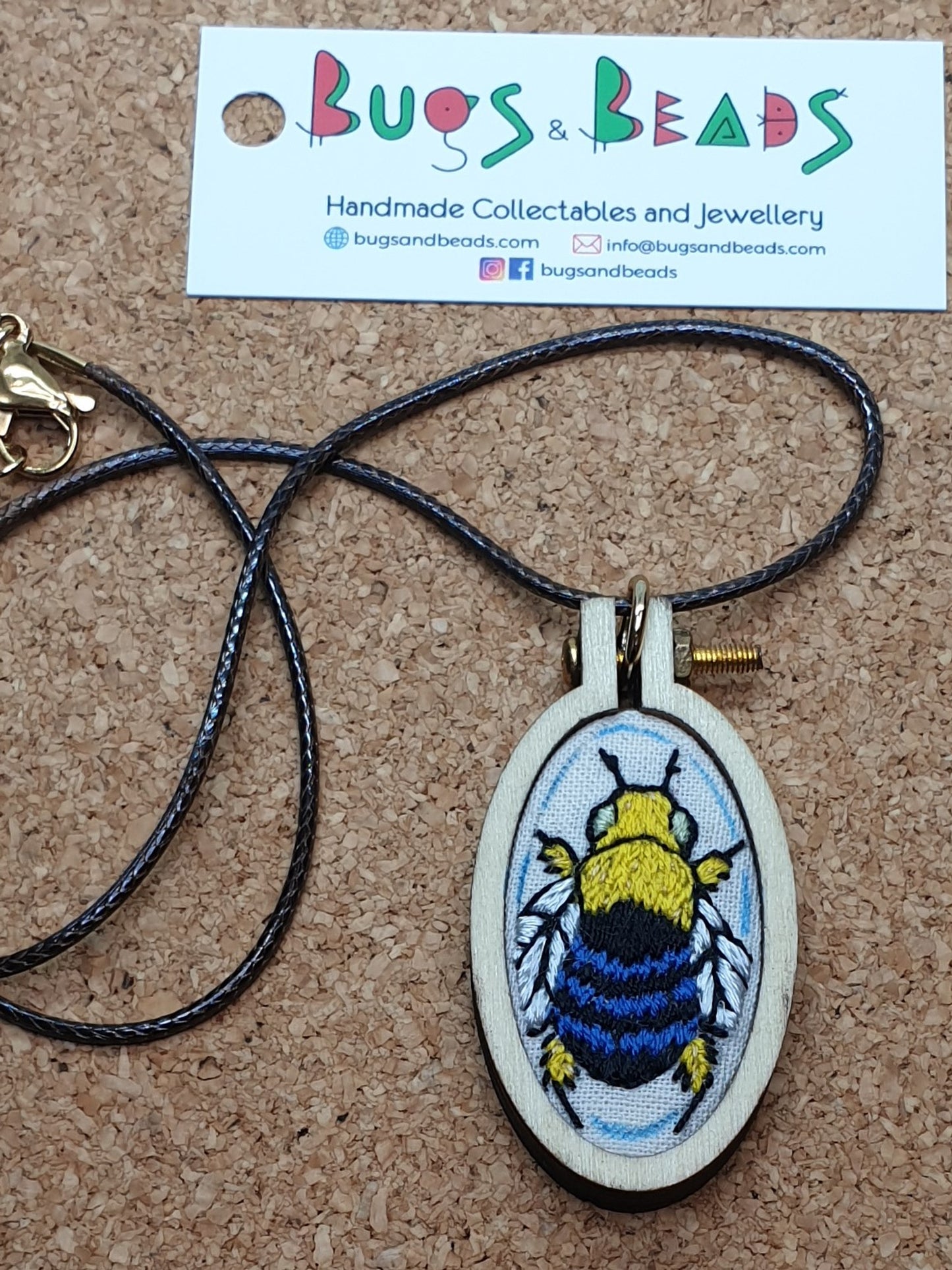 Blue Banded Bee hand embroidered pendant