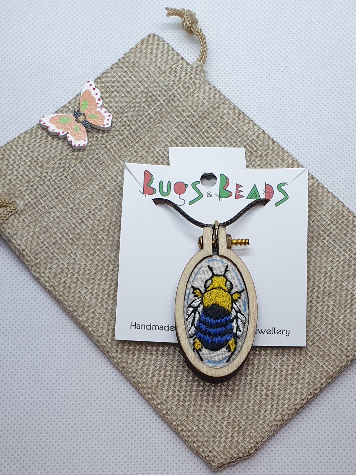 Blue Banded Bee hand embroidered pendant