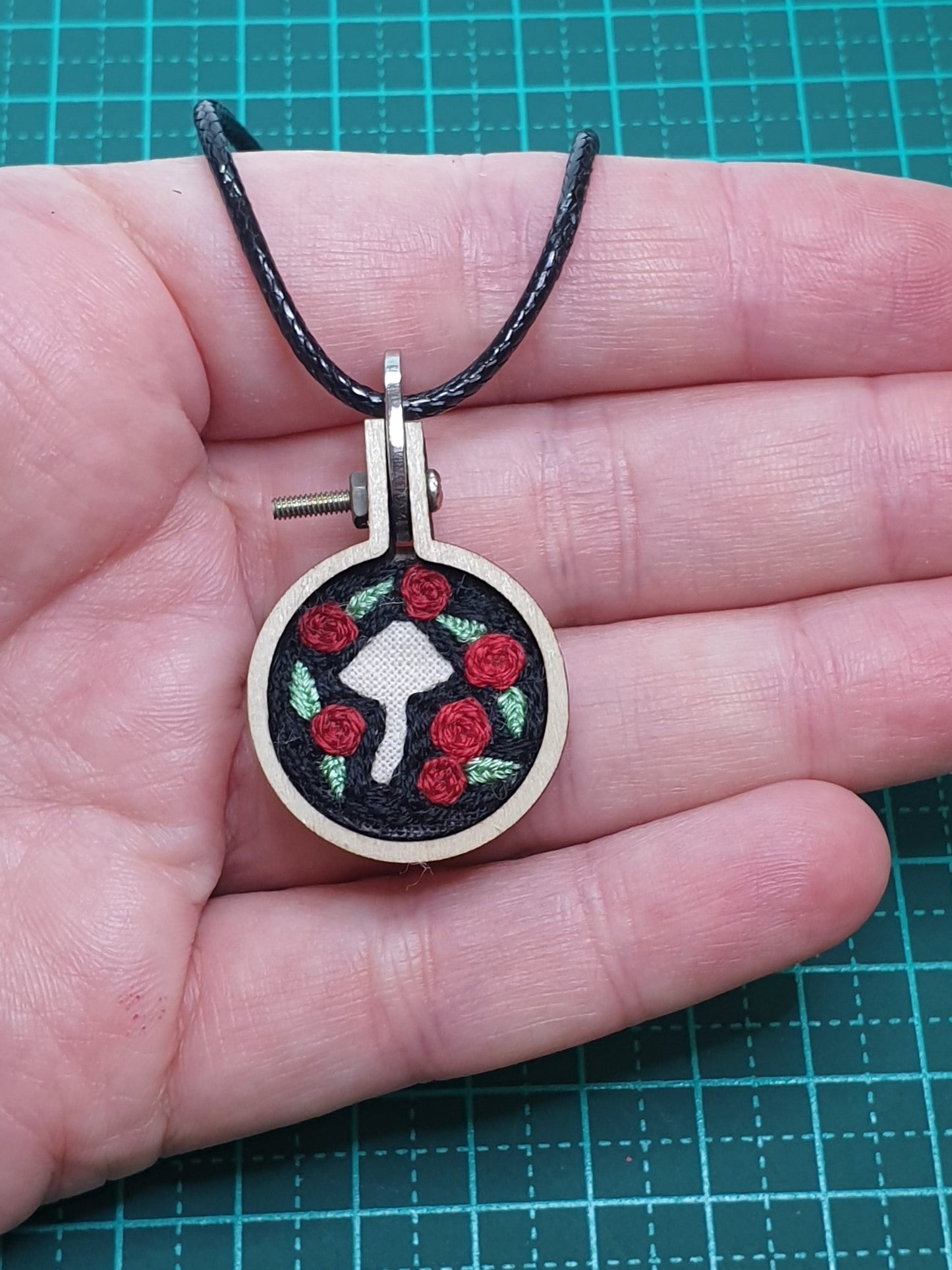 Mushroom silhouette hand embroidered pendant