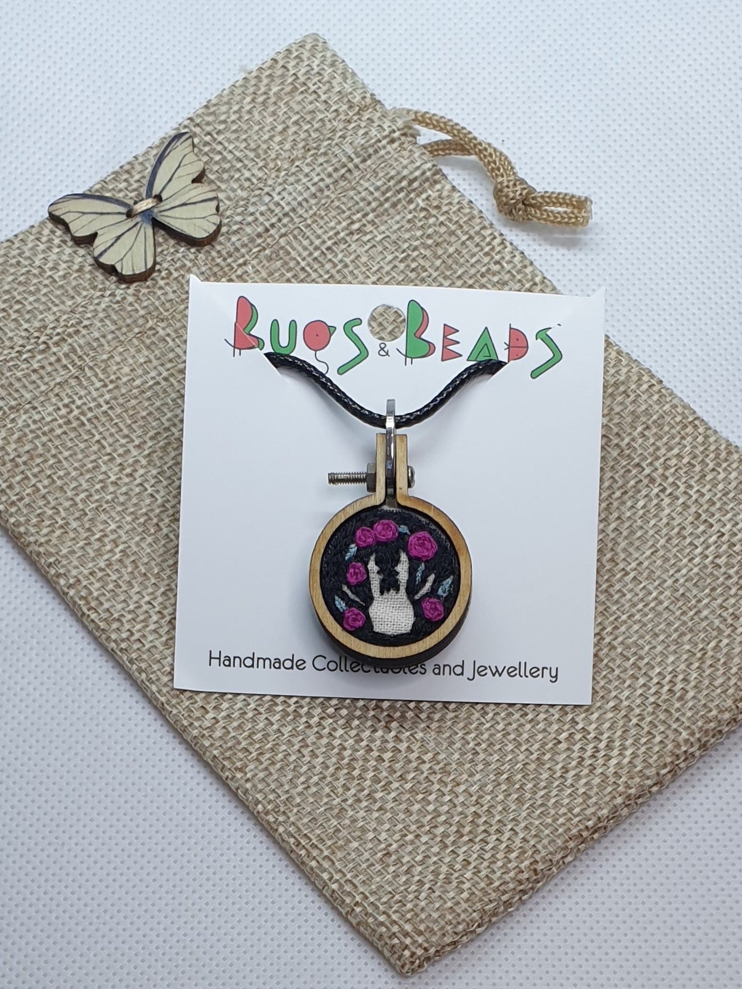 Stag Beetle silhouette hand embroidered pendant