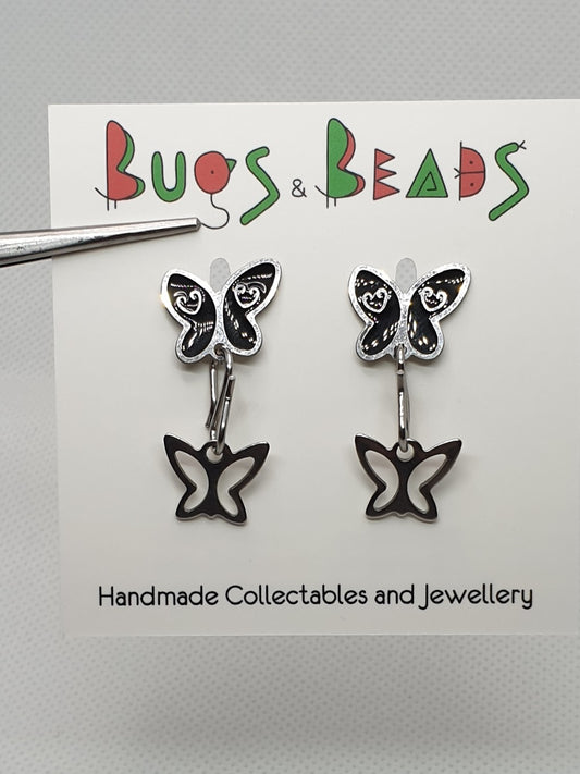 Black butterfly stud earrings