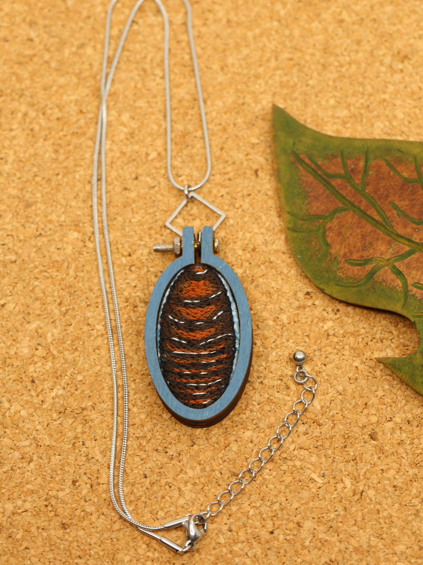 Burrowing cockroach embroidered necklace