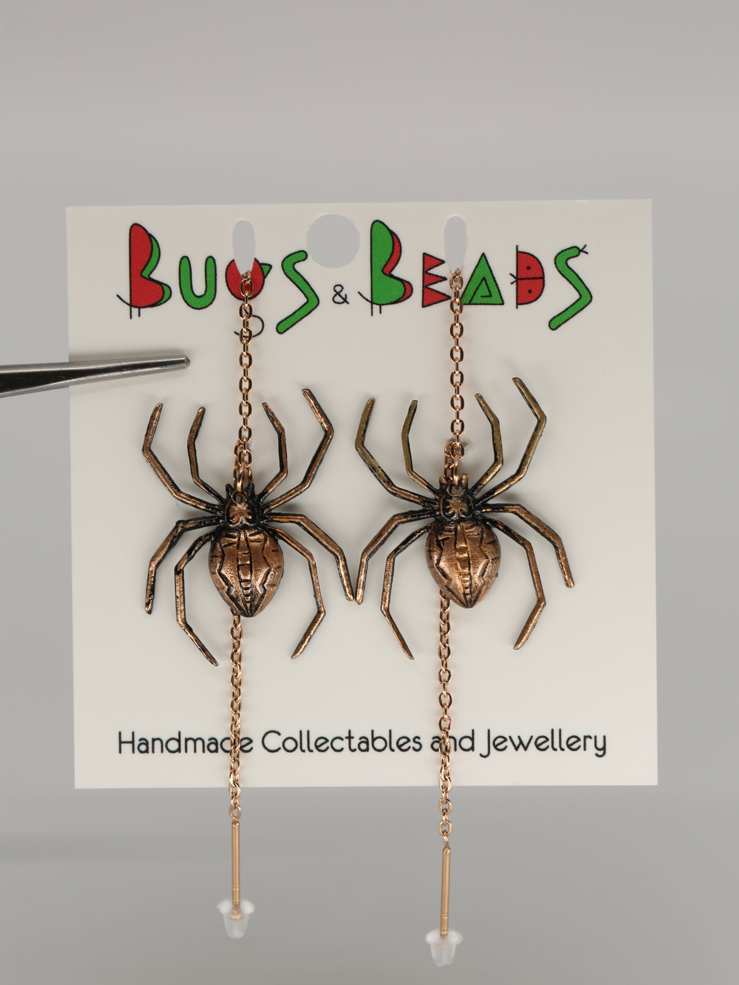 Spider earrings on a thread