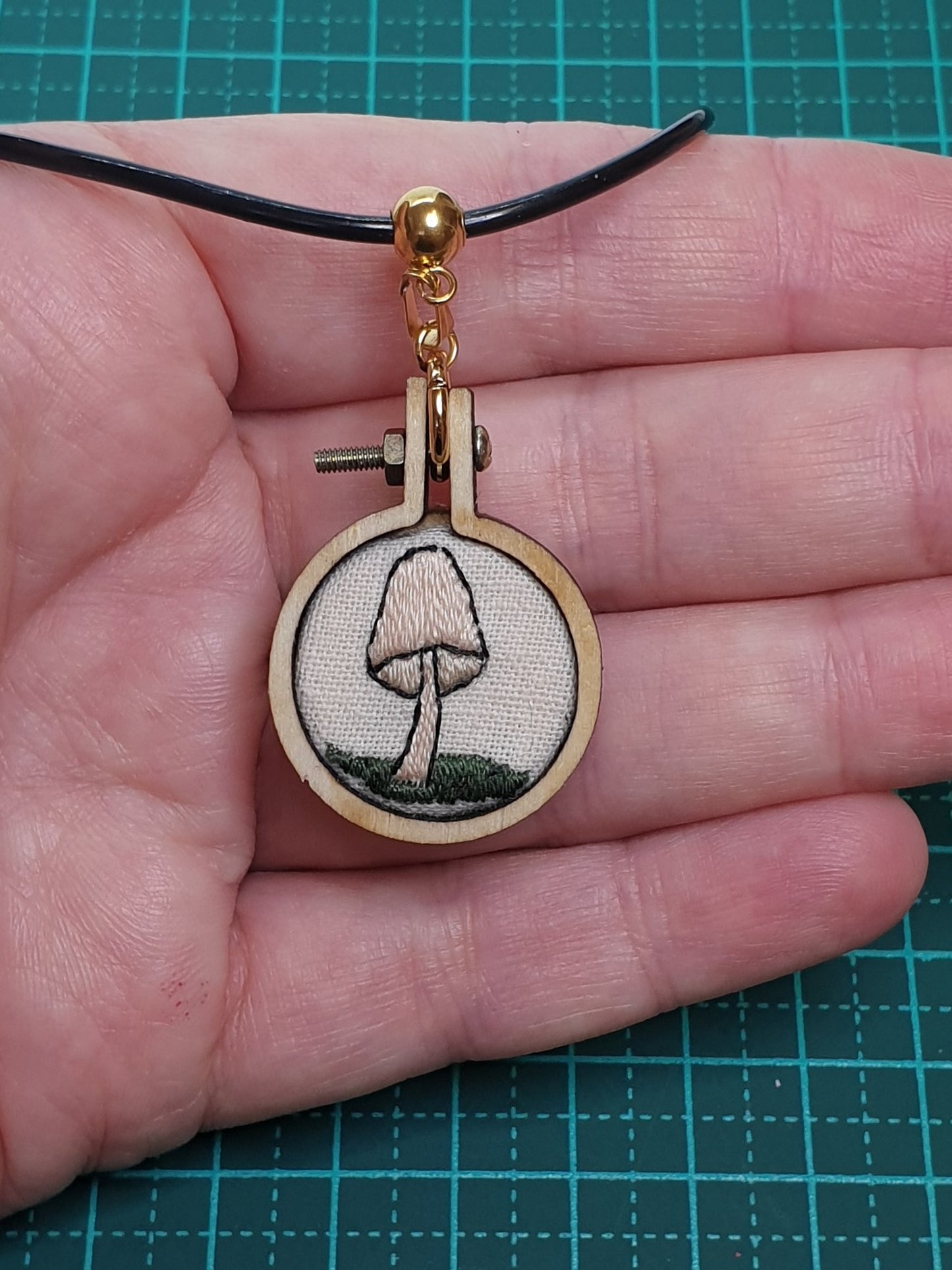 Cream mushroom hand embroidered pendant