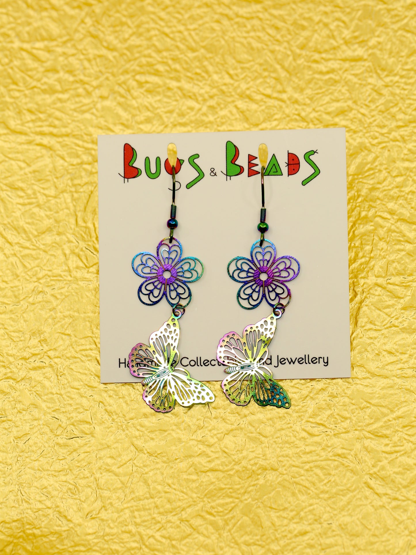 Rainbow butterfly on flower earrings